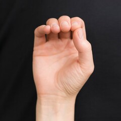 Obraz premium hand on the black background