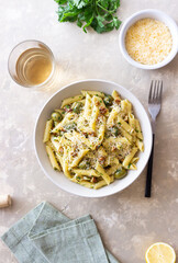 Pasta penne with olives, nuts, herbs and cheese. Healthy food. Italian cuisine. Vegetarian food.