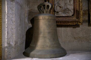 Obraz premium Antique Bronze Bell in Historical Setting