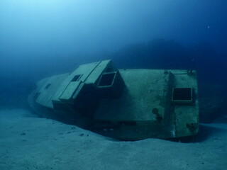 a boat wreck underwater metal on ocean floor 