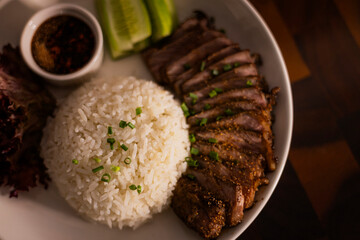 Steamed Rice And Grilled Meat On Plate