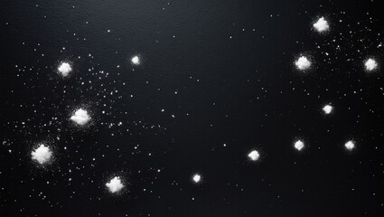 Fototapeta premium White dust particles and grain texture overlay on a black space background. Abstract design.