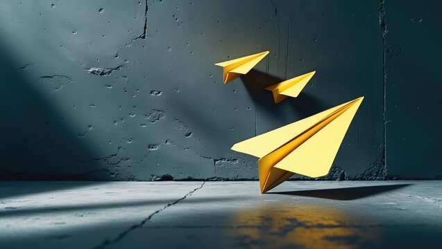 Think Big and Motivation in Business Theme. Yellow Paper Airplanes Soaring with Shadows on the Wall.