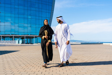 Middle-eastern beautiful couple wearing traditional clothing dating outdoors - Arab man with...