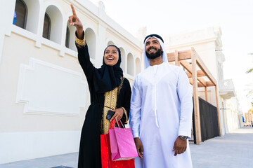 Middle-eastern beautiful couple wearing traditional clothing dating outdoors - Arab man with...