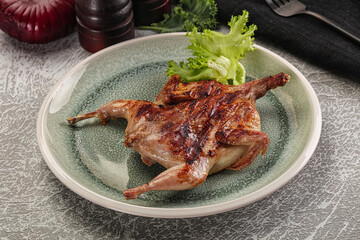 Grilled quail in the plate