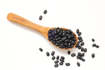 black beans on wooden spoon