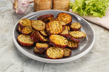 Baked red batat slices with herbs