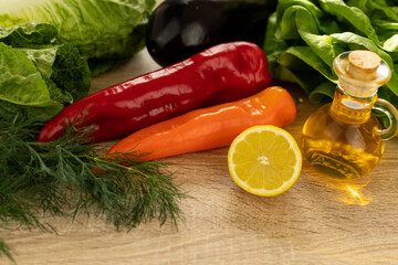 Cut lemon, red pepper.Fresh vegetables for salad in the kitchen.Proper nutrition