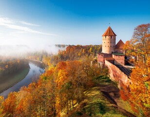 Naklejka premium Turaida Castle above the golden autumn forests of Gauja National Park.