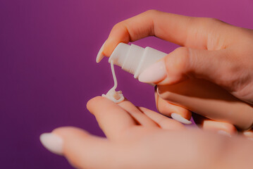 Hand holding blank plastic tubeoduct branding mockup. Copy space.