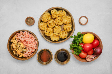 Fresh seafood and pasta ingredients prepared for a delightful cooking experience at home