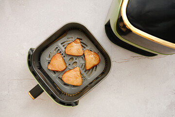 Juicy tuna steaks in an air fryer basket