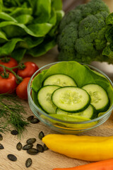 Paprika, chopped cucumbers on the table. The process of preparing a salad