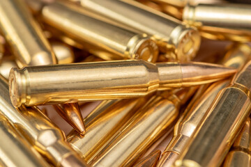 Naklejka premium shiny rifle cartridges, Symbolism of war, weapons and national resistance.