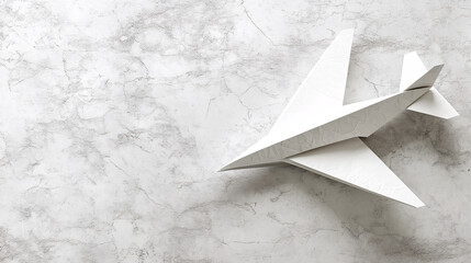A origami paper plane on a simple background.