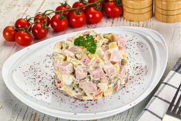 Russian traditional Olivier salad with sausages