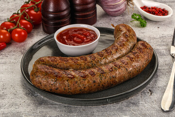 Grilled beef sausages with sauce