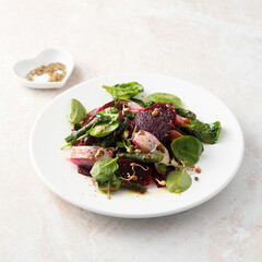 Herring salad with beetroot and spinach