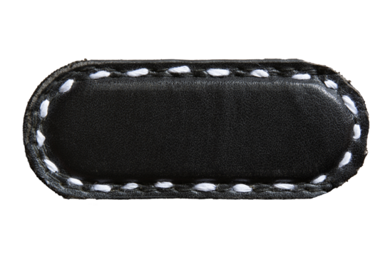 Black capsule shape leather piece with white stitch. Empty leather brand name tag