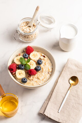 Oatmeal Bowl, Oat Porridge with berries, Banana and nuts in a Bowl, Healthy Snack or Breakfast