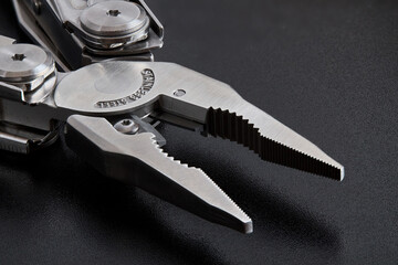 Pliers multi tool parts close up parts pivot point or fulcrum, pipe grip, tip, jaws or nose and...