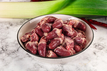 Raw chicken hearts in the bowl
