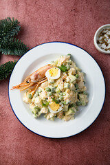 Russian salad with shrimps and avocado