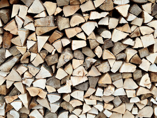 stack of cut firewood, natural wooden logs texture. rustic background. wood, eco, natural concepts....