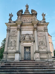 Large building with a lot of detail on it. The building is white and has a lot of statues on it. The building is very old and has a lot of history