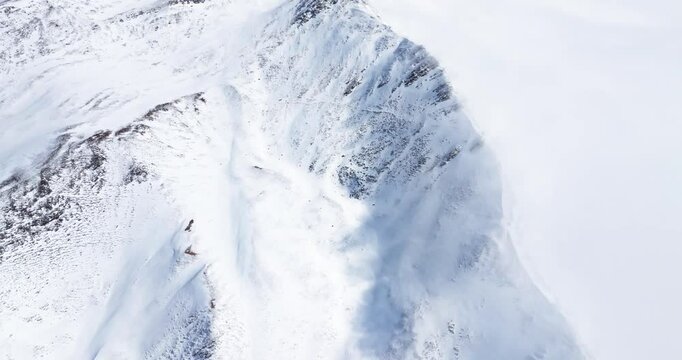 Aerial view of Snow mountain of Jiajinshan in Sichuan China with clouds and mist, amazing nature landscape