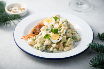 Russian salad with shrimps and avocado