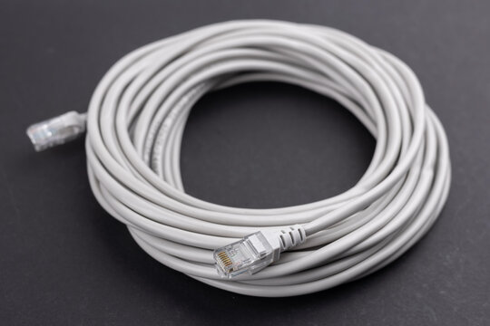 RJ45 Ethernet Network Internet Cable isolated on a dark background