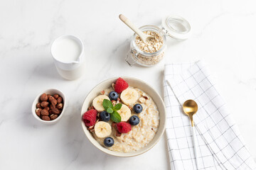 Oatmeal Bowl, Oat Porridge with berries, Banana and nuts in a Bowl, Healthy Snack or Breakfast