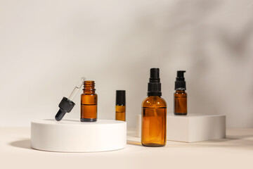 Amber cosmetic bottle on geometric pedestal podium, product packaging with natural shadows from plants