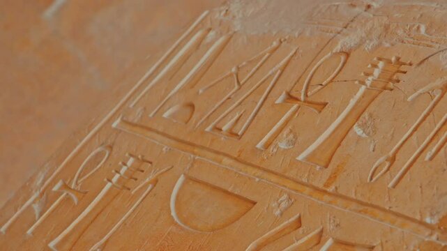 hieroglyph at the temple of Queen Hatshepsut in the background, Luxor, Egypt