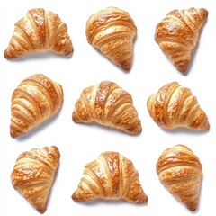 Golden croissants arranged in a grid pattern on a white background creating a visually appealing fresh baked pastry display perfect for breakfast