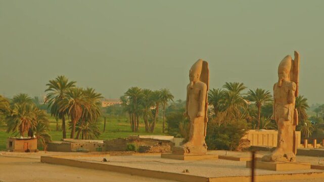 Colossi of Memnon, sunset, Luxor, Egypt