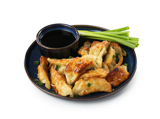Tasty fried gyoza (dumplings), onion and soy sauce isolated on white