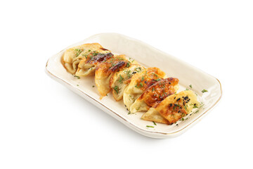 Tasty fried gyoza (dumplings) isolated on white
