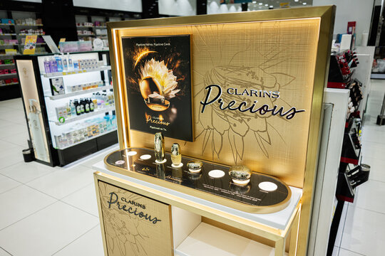 Clarins Precious luxury skincare display in a modern department store retail environment