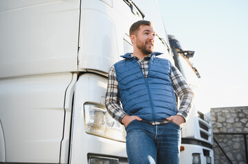 Portrait of confident truck driver on parking lot. Copy space