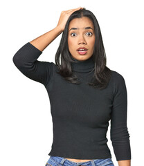 Simple portrait of a young Latina being shocked, she has remembered important meeting.