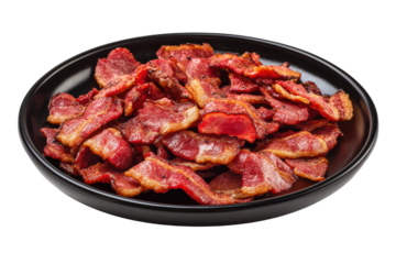 Crispy bacon strips on a black plate, ready to serve
