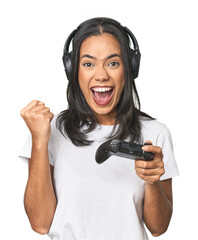 Joyful Latina gamer celebrating a victory