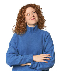 Young Caucasian redhead woman dreaming of achieving goals and purposes