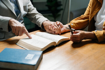 Christians are congregants join hands to pray and seek the blessings