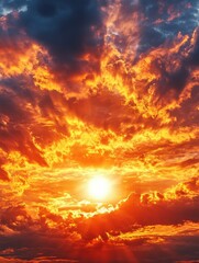 Fototapeta premium Fiery sunset with dramatic clouds painting the sky in vibrant orange and yellow hues creating a mesmerizing spectacle of nature