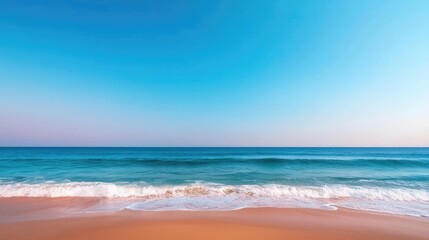 Obraz premium Beach waves landscapes concept. Serene ocean waves gently kiss the sandy shore under a vibrant blue sky.