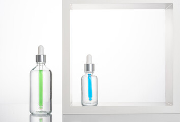 transparent dropper bottle with white bottom and colored dropper